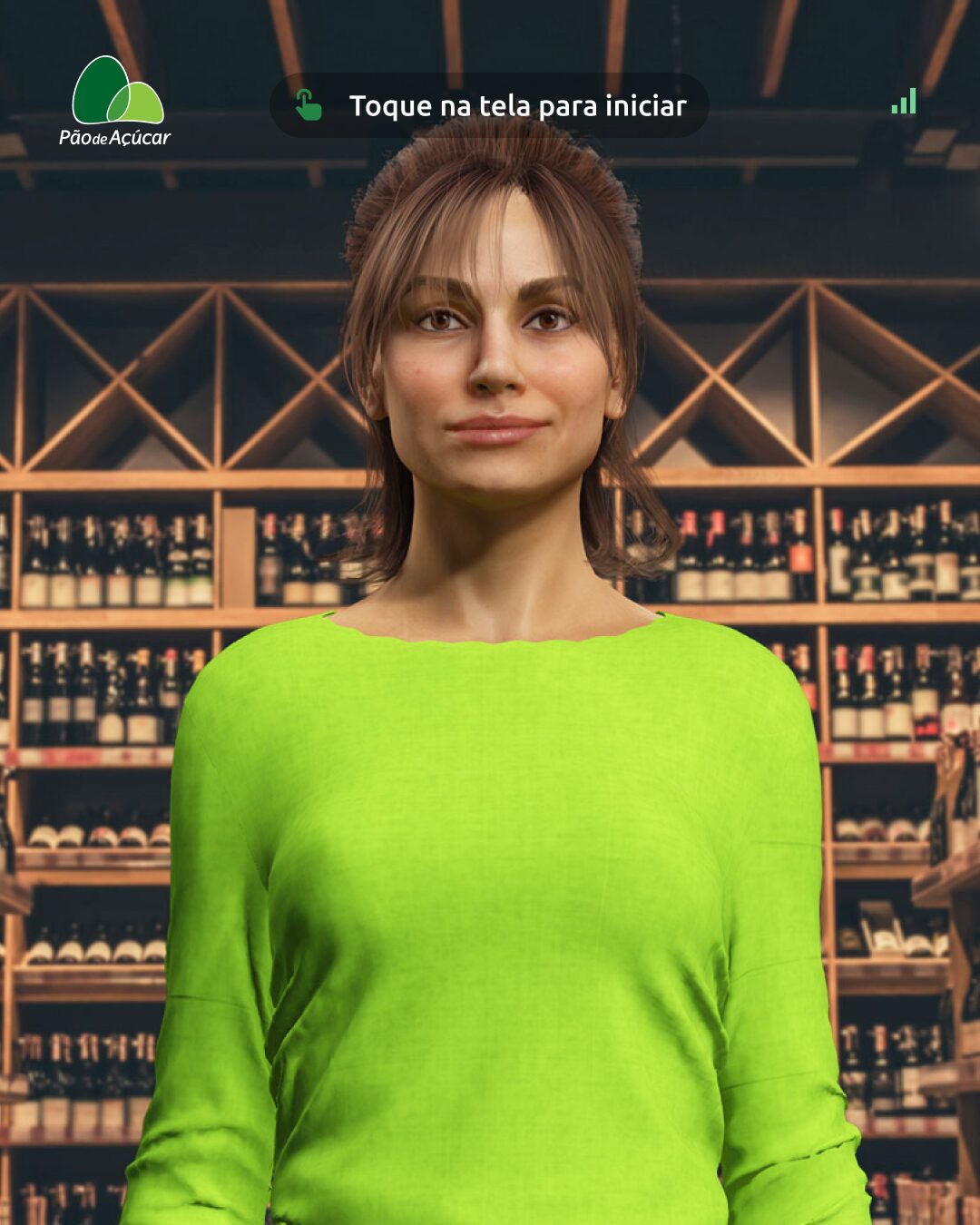 Paola · AI expert, in front of a Pão de Açúcar wine cellar, with the kiosk welcome prompt 'Toque na tela para iniciar'