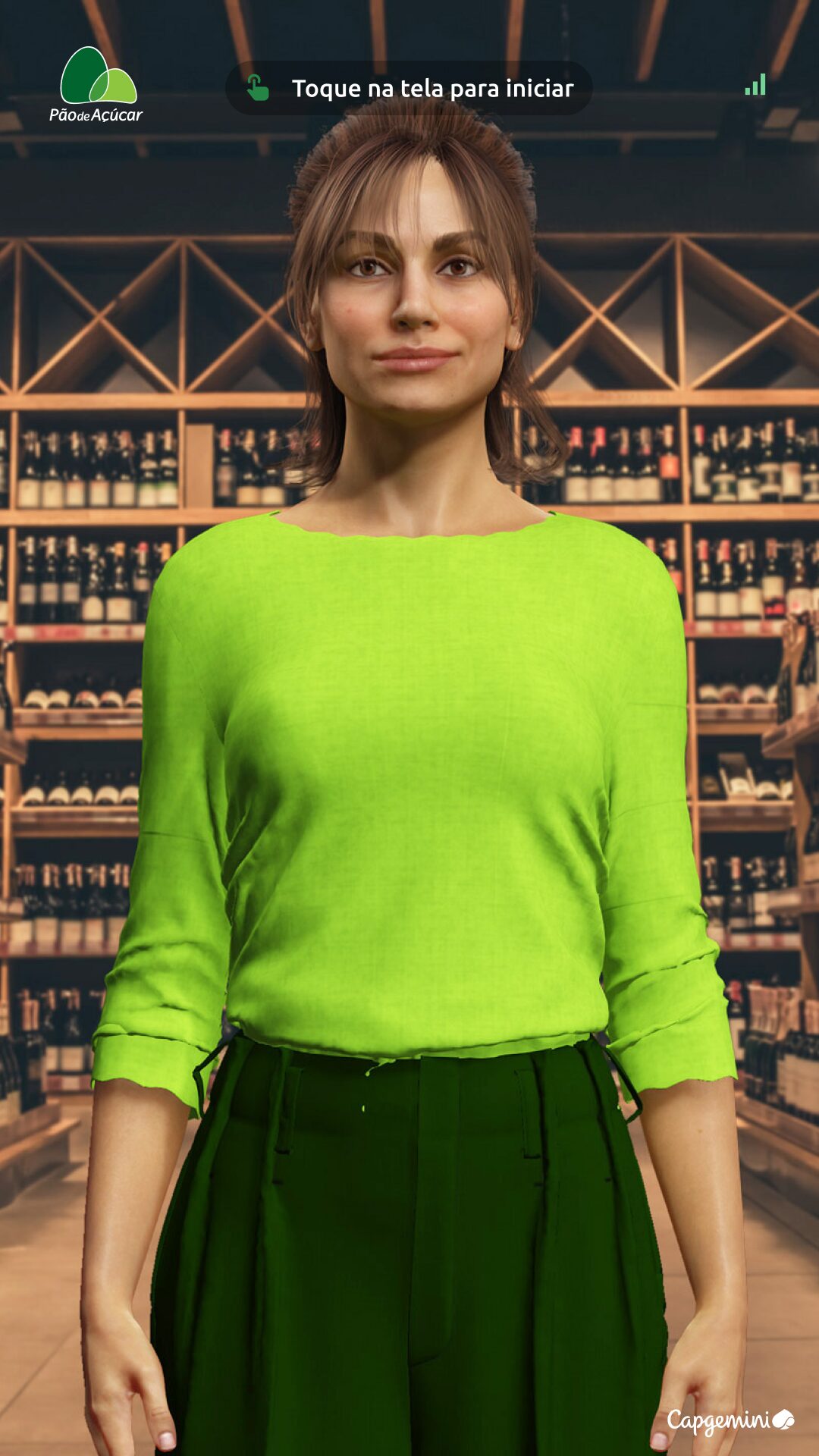 Kiosk welcome screen · Paola in green sweater, prompt 'Toque na tela para iniciar', Pão de Açúcar logo top-left, Capgemini bottom-right